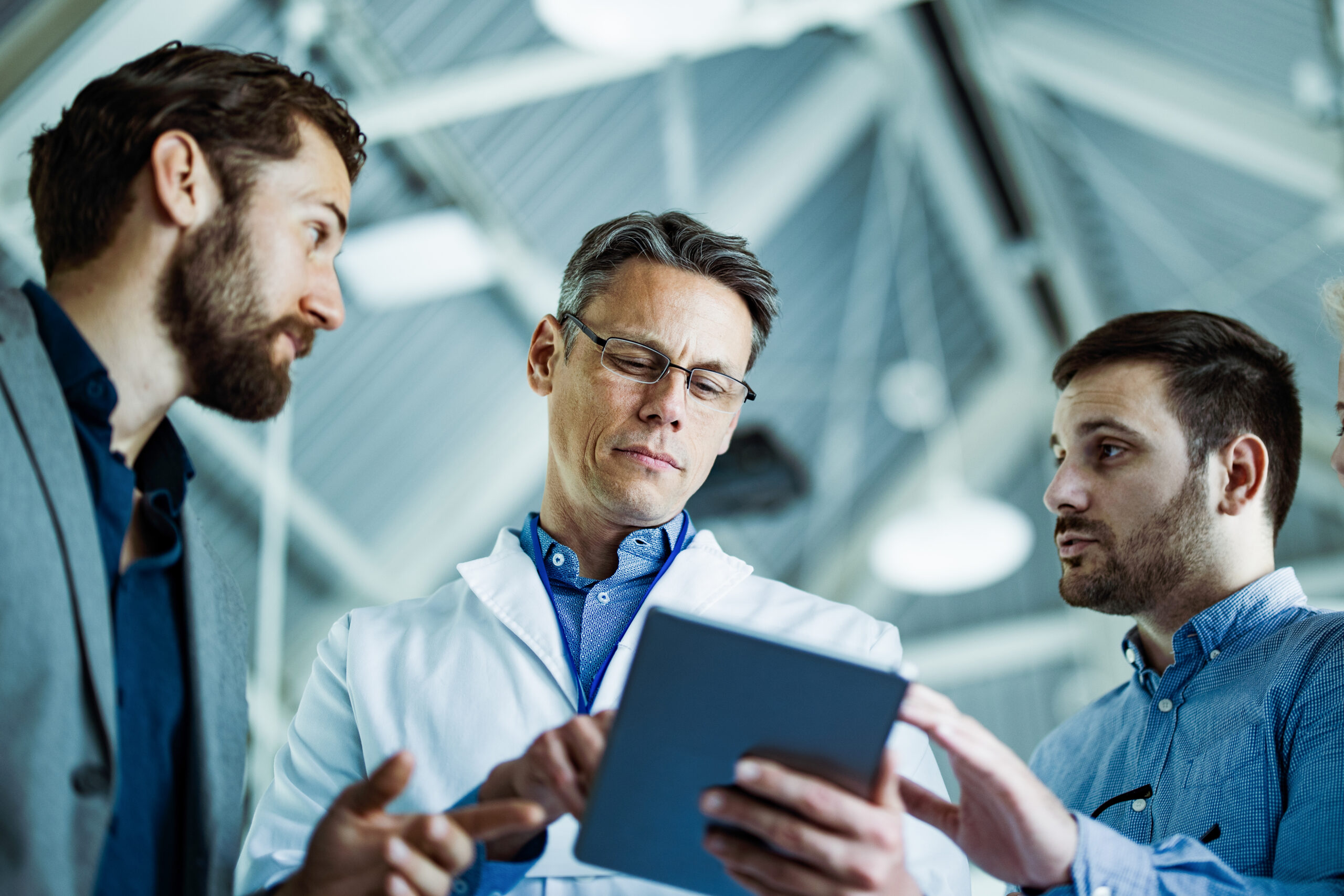 A physician gets updates from his marketing team regarding a recent campaign.